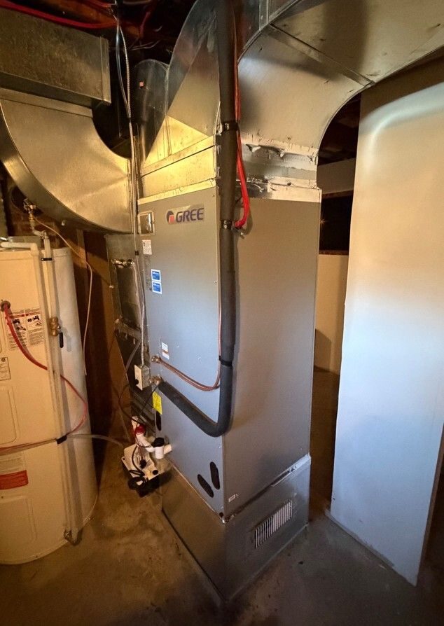 Gree central air handler and new ductwork installed in a basement